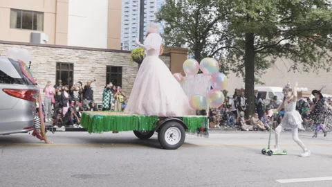 Good witch Glinda rides on float in Dragon con parade Stock Footage 296137634