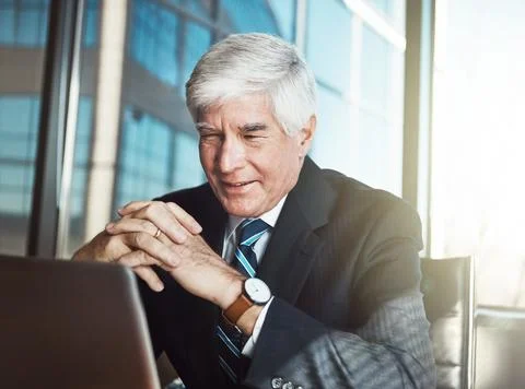 Good work is pleasing to the eye. a mature businessman working on his laptop in Stock Photos