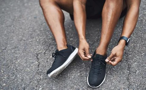 Good workout shoes really do make a difference. Closeup shot of a sporty man Stock Photos