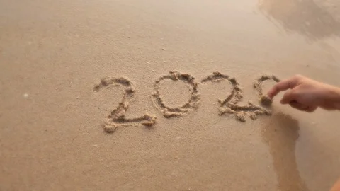 Goodbye 2020 year, sea wave washed off the handwritting. Stock Footage 121991926