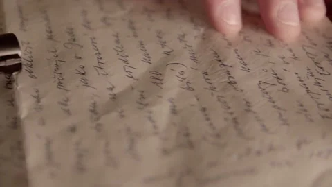 Goodbye letter after committing suicide, gun in hand closeup slider shot Vídeo Stock 160116375