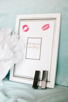 Goodbye note in the frame. Lipstick trail and lipstick. Stock Photos
