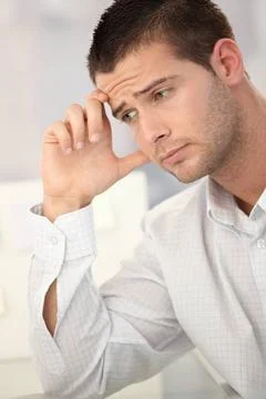 Goodlooking man having headache Goodlooking businessman having headache in... Stock Photos