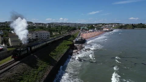 Goodrington, Devon, England: DRONE VIEWS: Steam train on route to Paignton Stock Footage 242615431