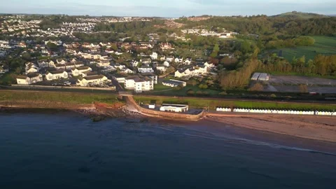 Goodrington Sands, Devon, England: DRONE VIEWS: Seafront promenade &amp; beach huts Stock Footage 240096504
