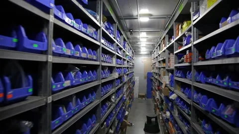 Goods and materials arranged on a rack in warehouse. Stock Footage 199014412