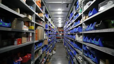 Goods and materials arranged on a rack in warehouse. Stock Footage 199014538
