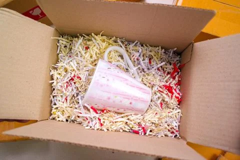 Goods delivery concept. A lining drinking glasses with recycled paper to protect 스톡 사진
