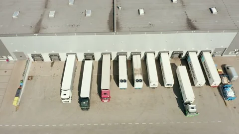 Goods distribution warehouse. Semitrailers load cargo containers. Stock Footage 205854836