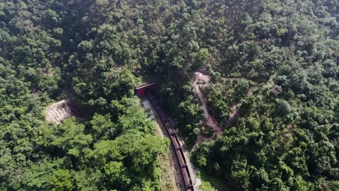 Goods train going in the mountain tunnel drone shot 4k 30p Stock Footage 232331823