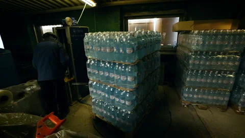 Goods wrapping process. Water packaging. Preparation for shipment. Stock Footage 118300416