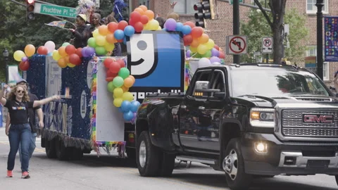 Goodwill employees ride on float at annual Atlanta pride parade Stock Footage 274367588