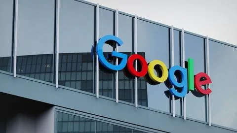 Google Alphabet Stock data presented on the logo of the office facade editorial Stock Photos