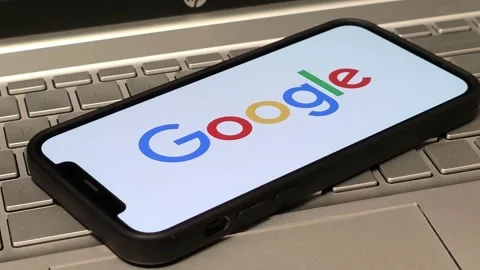 Google American technology company logo displayed on mobile phone Stock Footage 324705007