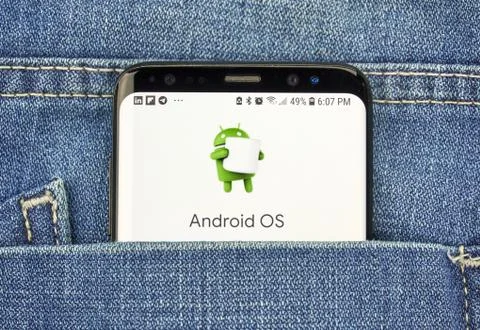 Google Android OS on a phone screen in a pocket Stock Photos