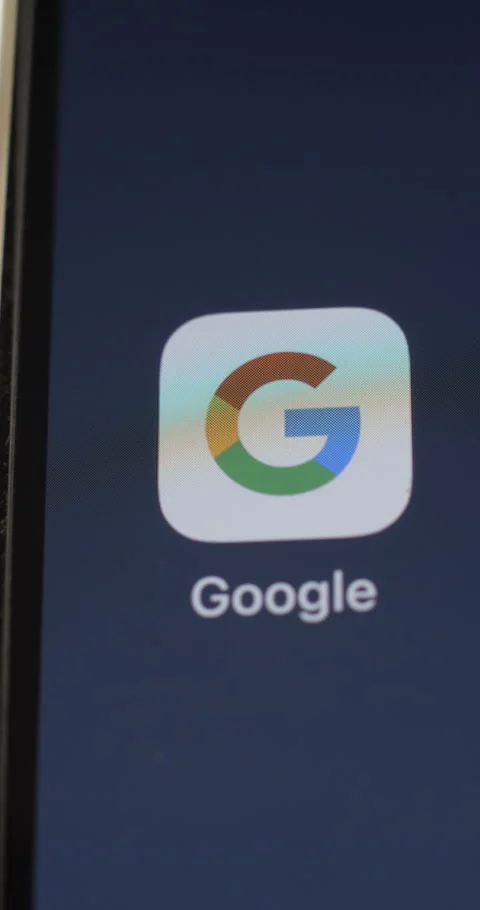 Google app on smartphone’s screen rotating Stock Footage 301256755