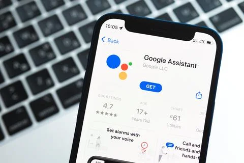 Google assistant app on the iPhone screen, application icon close-up photo Stock Photos