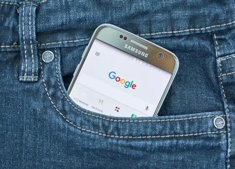 Google Assistant mobile application on screen of Samsung Stock Photos