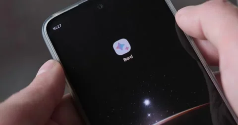 Google Bard AI chat bot phone screen shortcut opens homepage Stock Footage 241588422