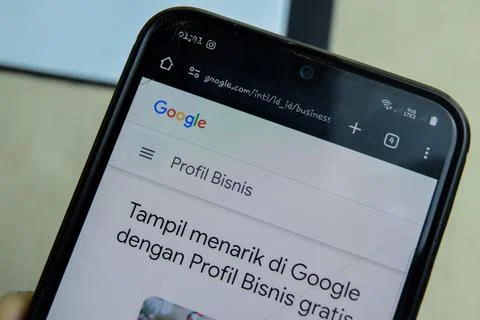 Google Business application on Smartphone screen. Photos