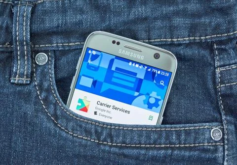 Google Carrier Services mobile application on screen of Samsung Stock Photos