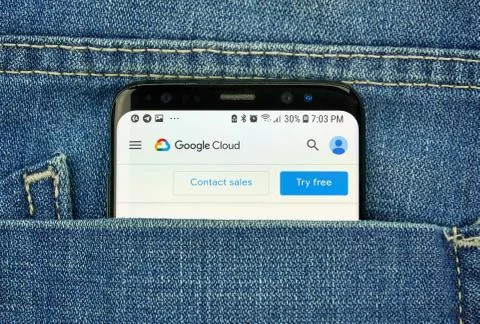 Google Cloud Platform on a phone screen in a pocket Stock Photos