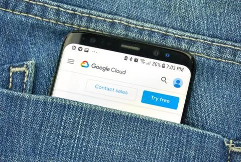 Google Cloud Platform on a phone screen in a pocket Stock Photos