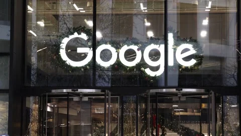 Google company logo above the front doors with people entering the building. Stock Footage 326572280