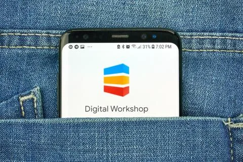 Google Digital Workshop on a phone screen in a pocket Stock Photos