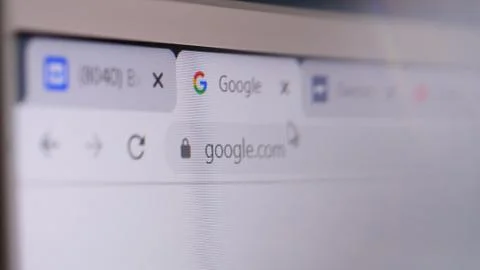 Google domain name in browser and logo on the computer screen. Editorial macro Foto stock