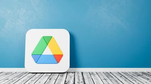 Google Drive App Logo 3D Symbol Shape on Wooden Floor Against Blue Wall with Stock Illustration