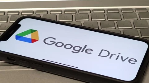 Google Drive file hosting service logo displayed on mobile phone Stock Footage 324705205