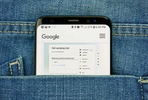 Google Forms on a phone screen in a pocket Stock Photos