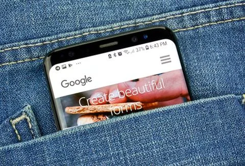 Google Forms on a phone screen in a pocket Stock Photos