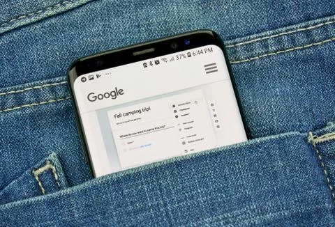 Google Forms on a phone screen in a pocket Stock Photos