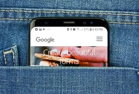 Google Forms on a phone screen in a pocket Stock Photos