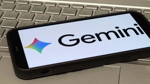Google Gemini AI assistant logo displayed on mobile phone Stock Footage 324705219