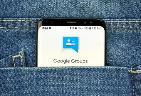 Google Groups app on a phone screen in a pocket Stock Photos