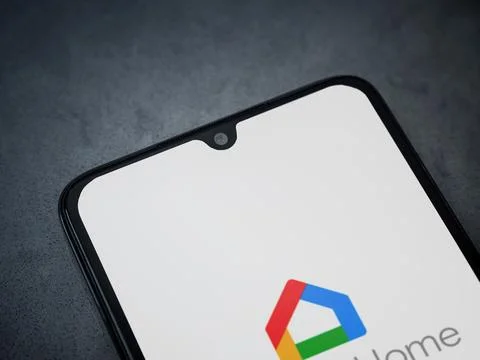 Google Home app launch screen on smartphone on dark marble stone background Stock Photos