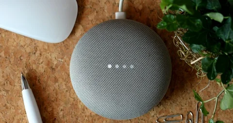 Google Home Mini On The Cork Desk Stock Footage 124650062