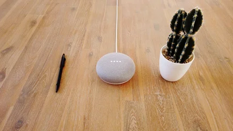 Google Home Mini - Smart Voice Assistant Controlled Gadget Responding To Command Stock Footage 102374145