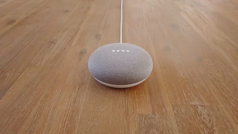 Google Home Mini Smart Voice Assistant Controlled Gadget Responding To Command Stock Footage 102374286
