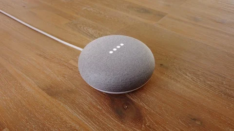 Google Home Mini - Smart Voice Assistant Controlled Gadget Responding To Command Stock Footage 102374291