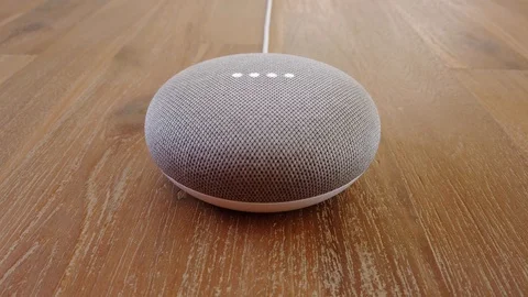 Google Home Mini - Smart Voice Assistant Controlled Gadget Responding To Command Stock Footage 102374319