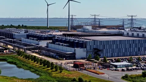 Google hyperscale data center powered by wind turbines in Eemshaven, Netherlands Stock Footage 344428395