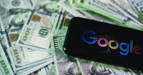 Google Logo on iphone surrounded by $100 Bills. Google Profits Layout. Stock Footage 169008922