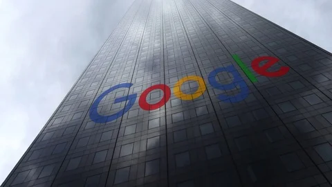 Google logo on a skyscraper facade reflecting clouds, time lapse. Editorial 3D Stock Footage 81061915