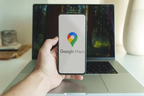 Google maps application logo in front of laptop. High quality photo Stock Photos
