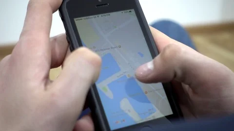 Google Maps On Mobile Cell Phone - Man looking searching Los Angeles USA Video stock 73597312