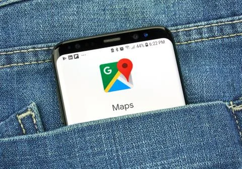 Google Maps on a phone screen in a pocket Фото